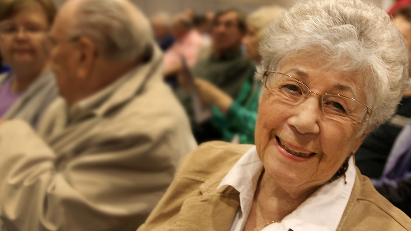 Woman smiling at a Dakota County Library program.