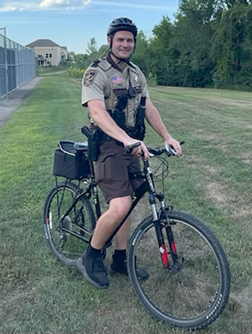 Member of Bike Patrol on a bike.