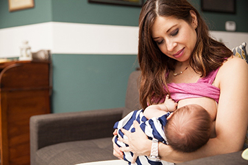 Mother breastfeeding a baby.