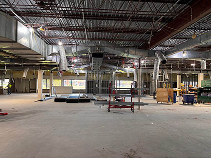 Progress of construction at Burnhaven Library with walls, ceilings and floors removed.
