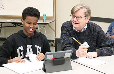 A student received help from a volunteer tutor at the Burnhaven Library. 