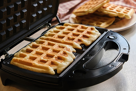 Waffles in a waffle iron.