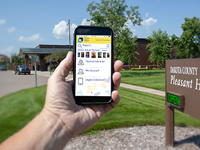 Closeup of smartphone with the app on it.
