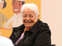 Woman smiling at a Dakota County Library event.
