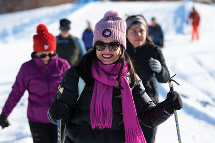 Woman smiling while cross-country skiing at Lebanon Hills Regional Park.