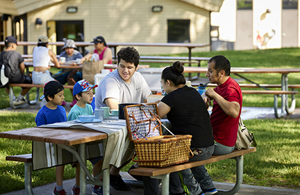 Family at a picnic table. 