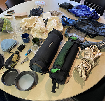 Outdoor gear on a table.