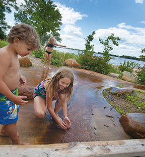 Kids playing at the Lake Byllesby Splash Pad.