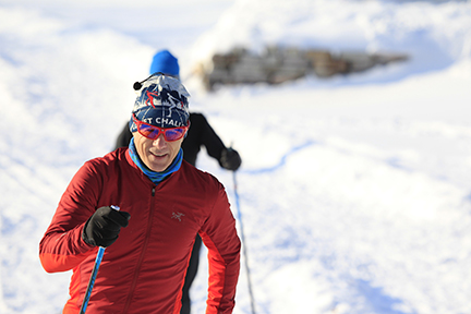 Closeup of man cross-country skiing.