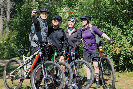 Four people taking a selfie on the West Trailhead.