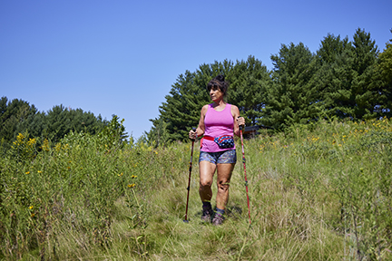 Woman hiking at Whitetail Woods Regional Park.
